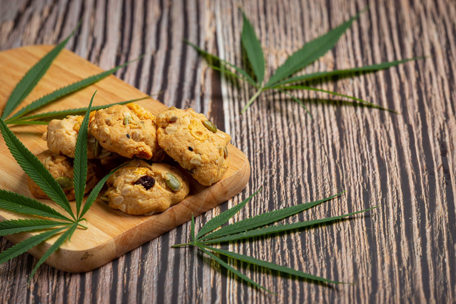 cannabis-cookies-cannabis-leaves-put-wooden-cutting-board